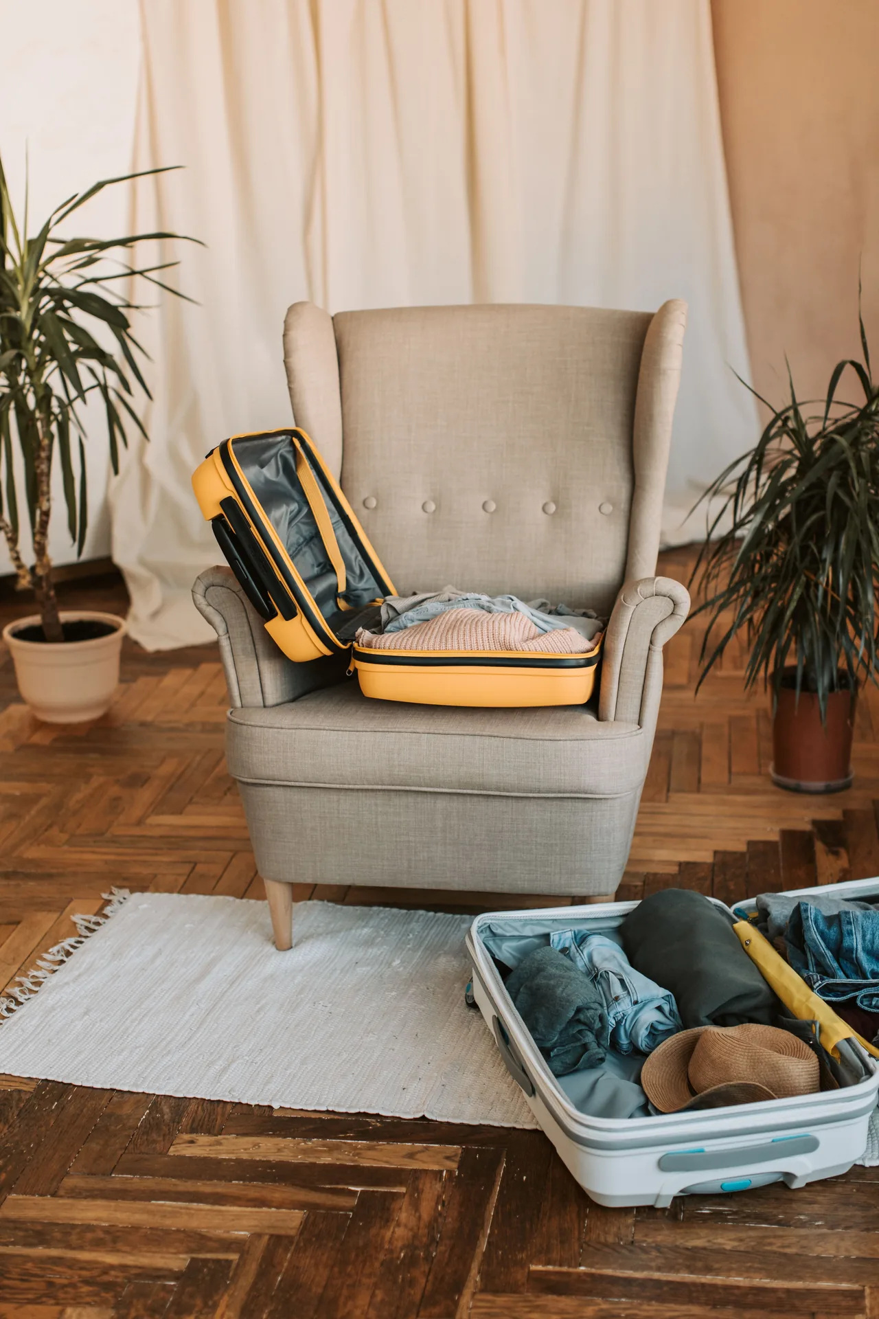 A packed suitcase resting on a chair, ready to leave