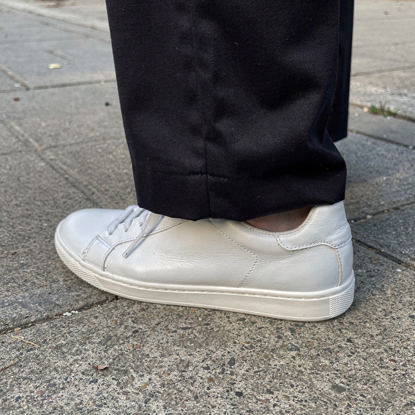Close-up of a pants hem showing the right amount of break at the shoe