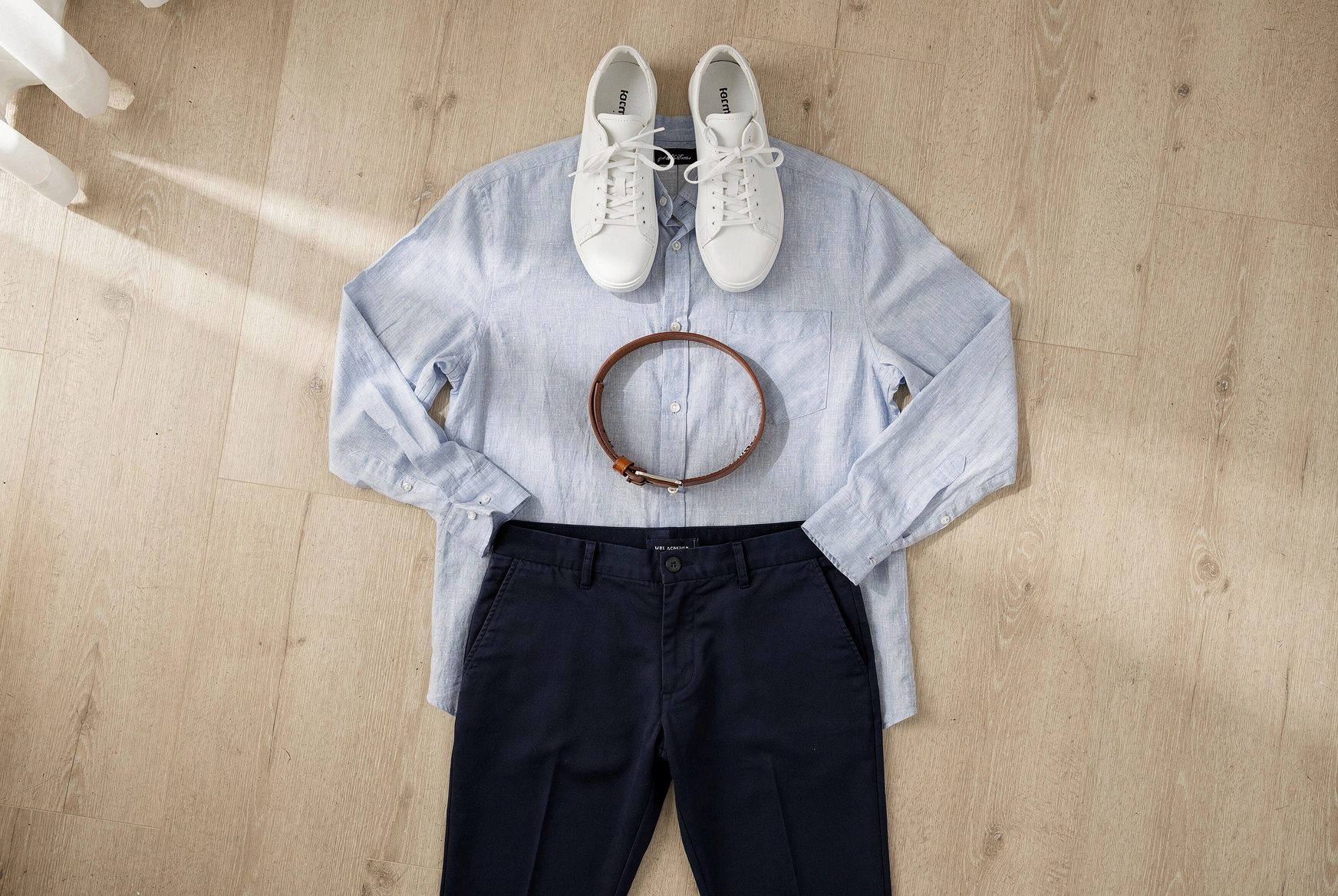 A neutral outfit flat-lay showing how basics and an accent color come together